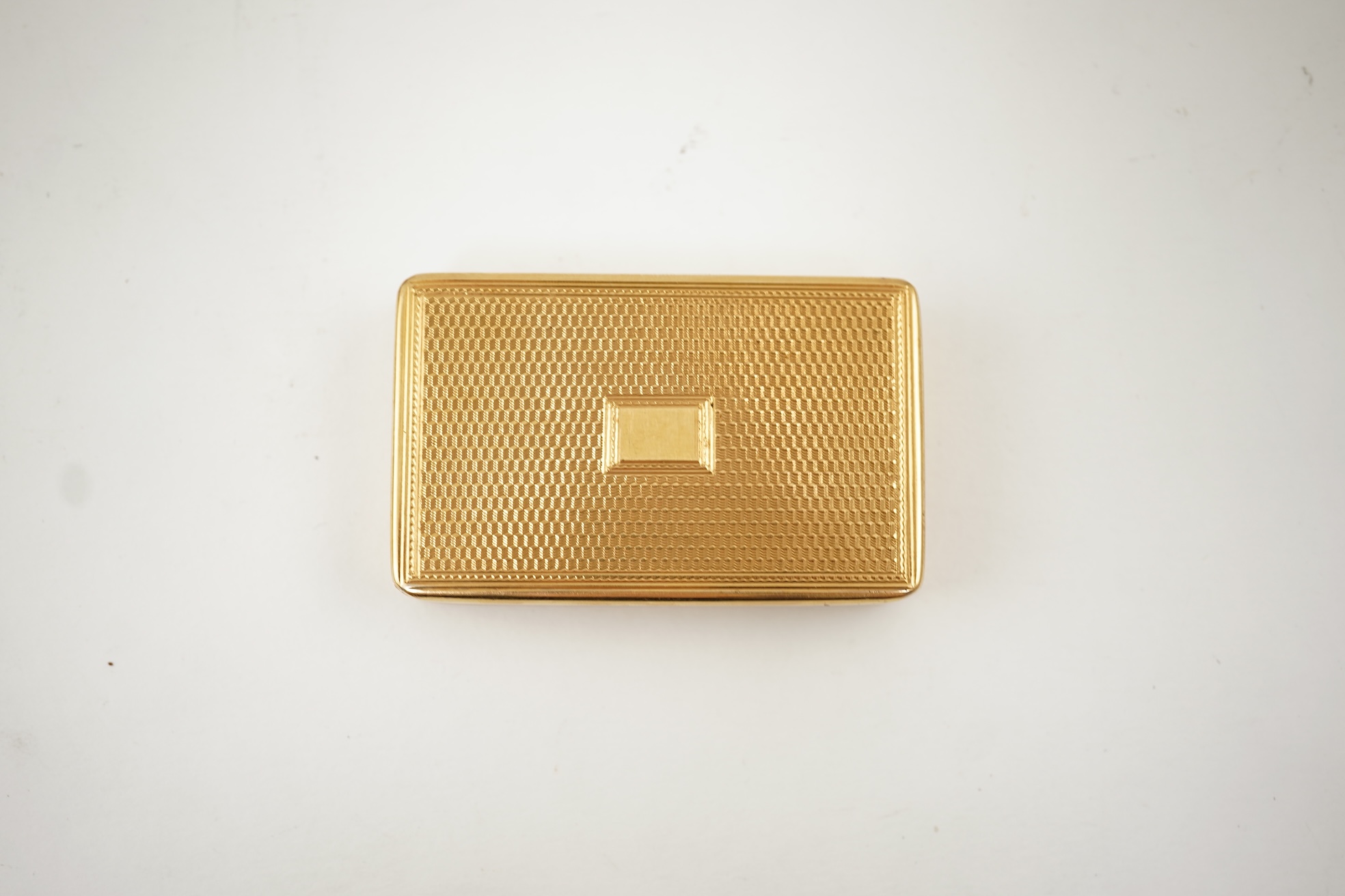 An Edwardian engine turned 18ct gold rectangular snuff box, by Joseph Walton